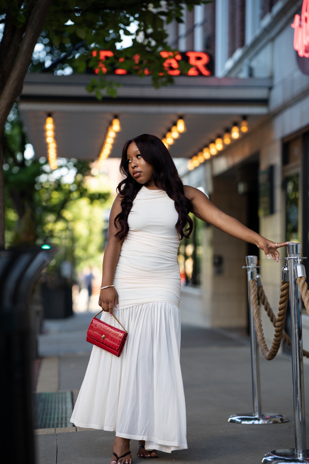 Full-length outdoor portrait in a white dress
